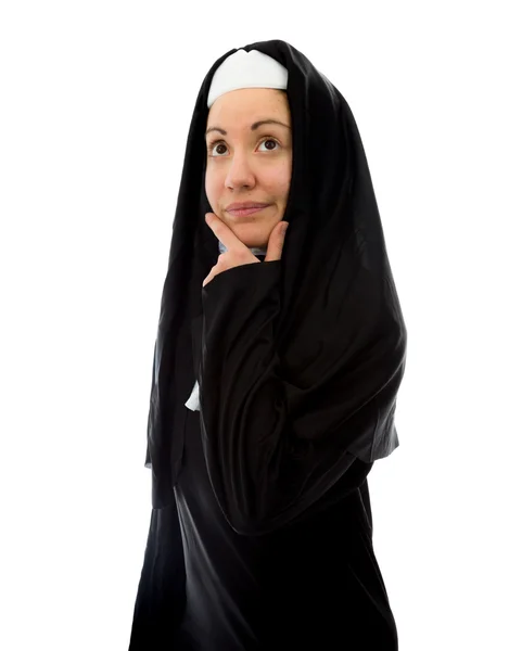 Монахиня думает рукой на подбородке — стоковое фото