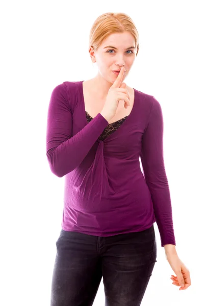 Kvinna med fingret på läpparna — Stockfoto