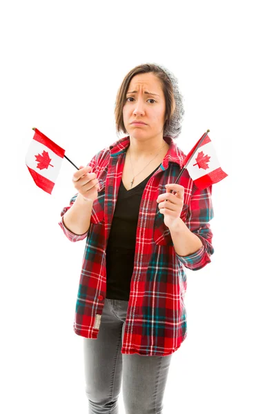 Sad woman holding Canadian flags — Stock Photo, Image