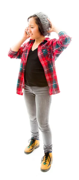 Woman talking on phone with  hand on head — Stock Photo, Image