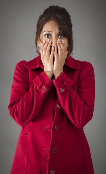 Woman with hands over mouth — Stock Photo, Image