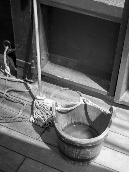 Bucket and mop on the deck — Stock Photo, Image