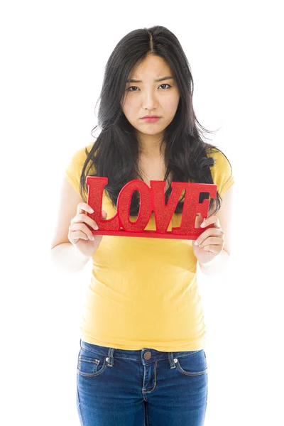 Woman holding "LOVE" text — Stock Photo, Image