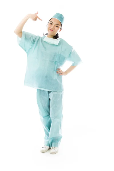Surgeon pointing at herself — Stock Photo, Image