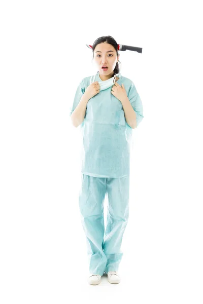 Surgeon with knife shaped hair band — Stock Photo, Image