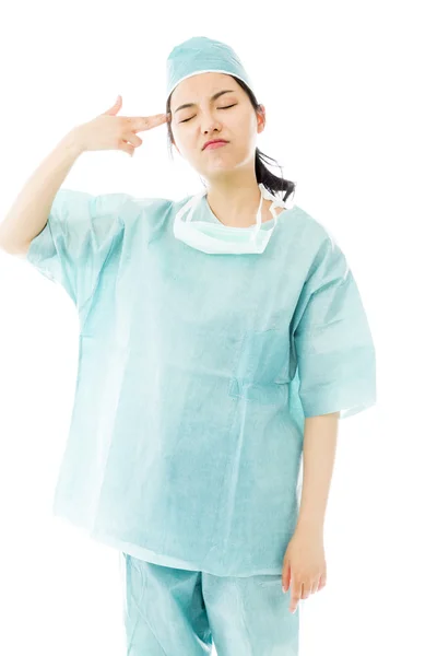 Surgeon pointing fingers to head — Stock Photo, Image