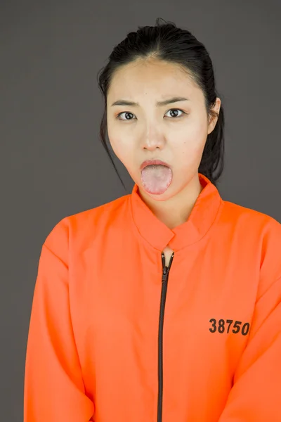 Woman sticking out tongue — Stock Photo, Image