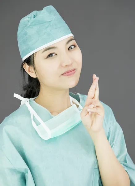 Surgeon crossing fingers — Stock Photo, Image