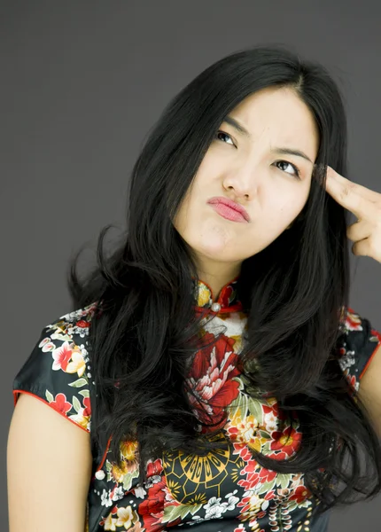 Woman pointing fingers to head — Stock Photo, Image