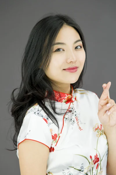 Woman crossing her fingers — Stock Photo, Image