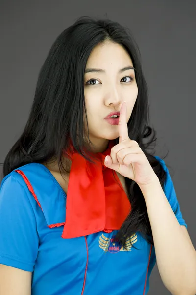 Stewardess with finger on lips — Stock Photo, Image