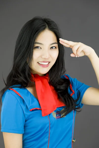 Stewardess pointing fingers to head — Stock Photo, Image