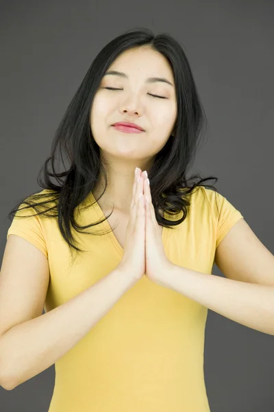 Woman in prayer position — Stock Photo, Image