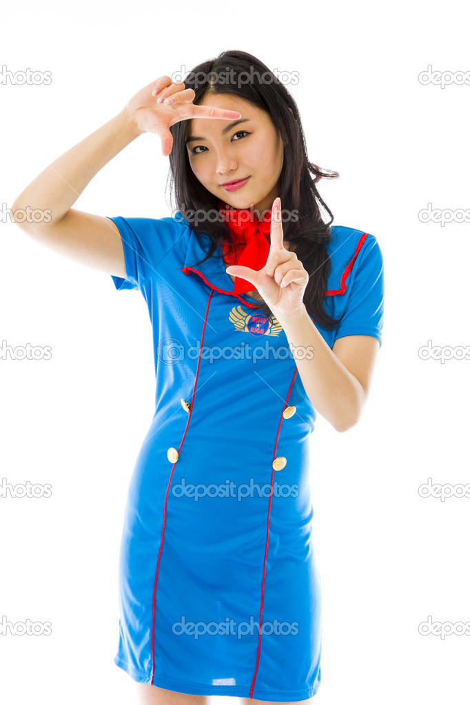 Stewardess looking through fingers frame