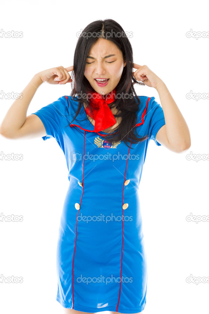 Stewardess with hands in ears