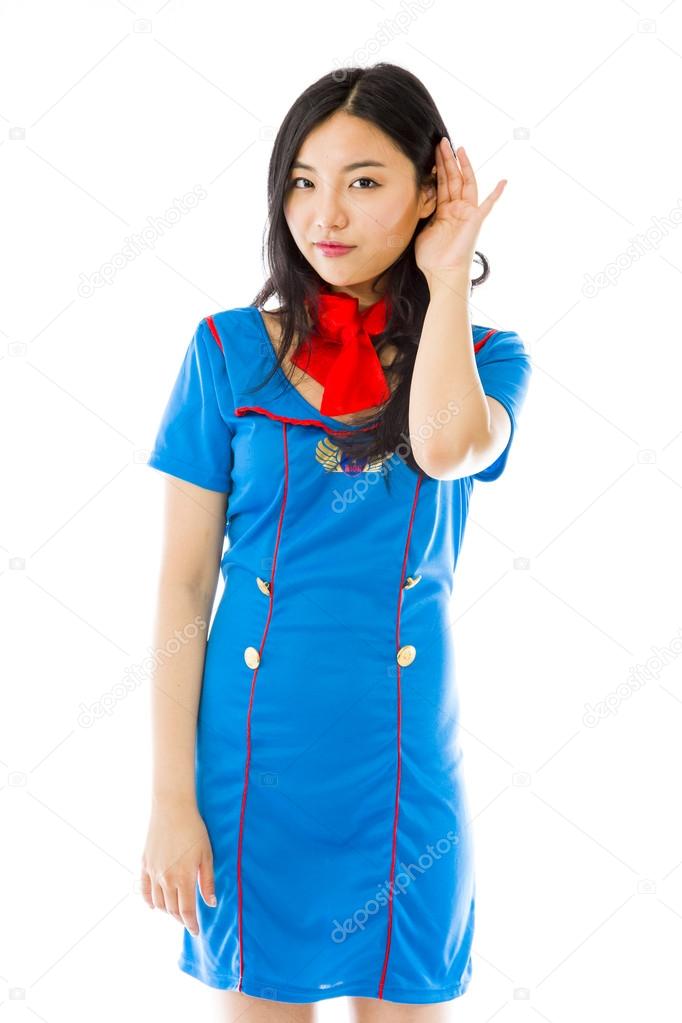 Air stewardess listening with hand to ear