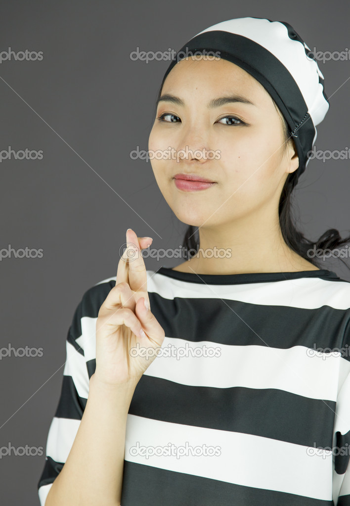 Woman with fingers crossed