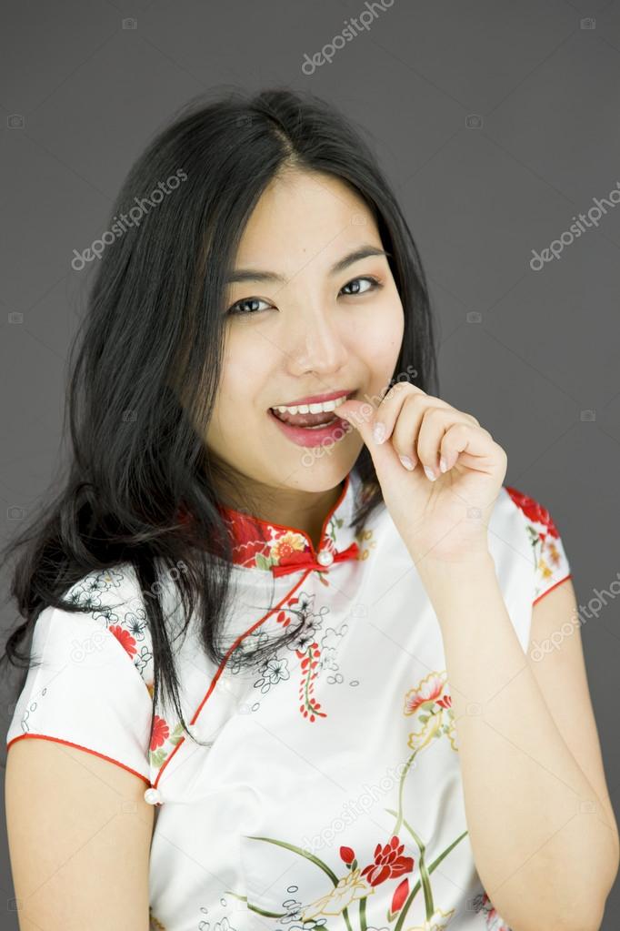 Woman with finger in mouth
