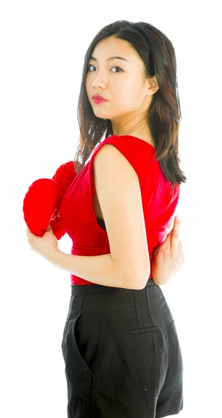 Woman with heart cushion — Stock Photo, Image