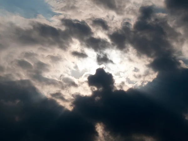 Sunbeams through clouds — Stock Photo, Image