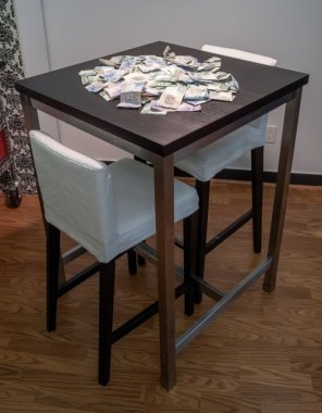Dollar bills on a table clipart