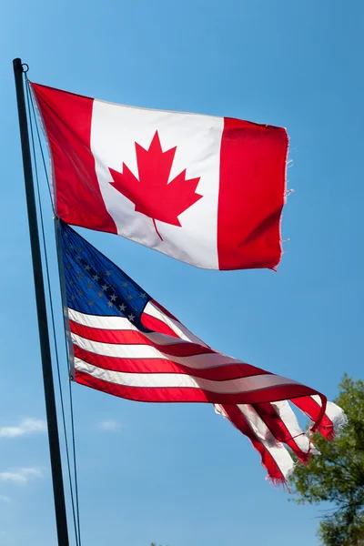 Canadian and American flags — Stock Photo, Image