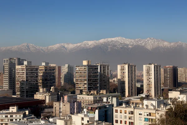 Skyscrapers with mountain — Stock Photo, Image