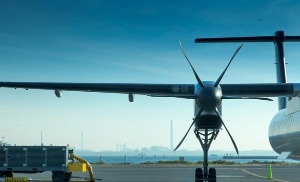 Airplane at an airport — Stock Photo, Image