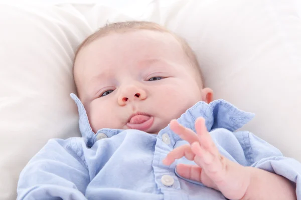 Baby boy sticking his tongue out — Stock Photo, Image