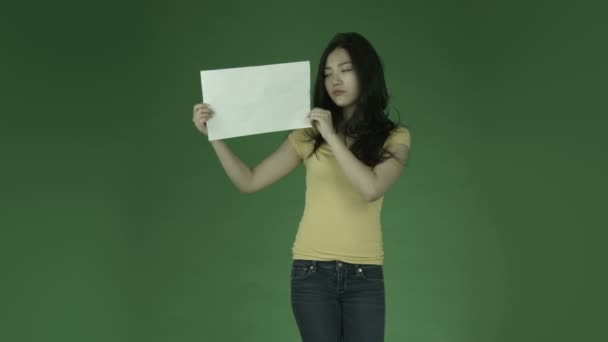 Asian woman upset with blank sign — Stock Video