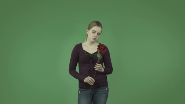 Girl depressed in love with roses — Stock Video