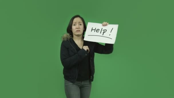 Girl in winter jacket with help sign — Stock Video