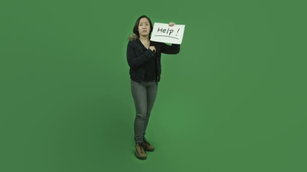 Girl in jacket with help sign — Stock Video