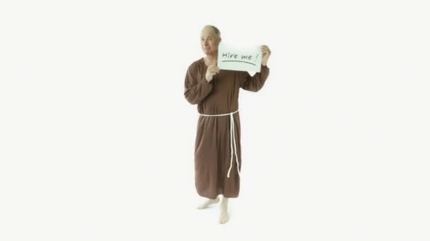 Monk holding hire me sign — Stock Video