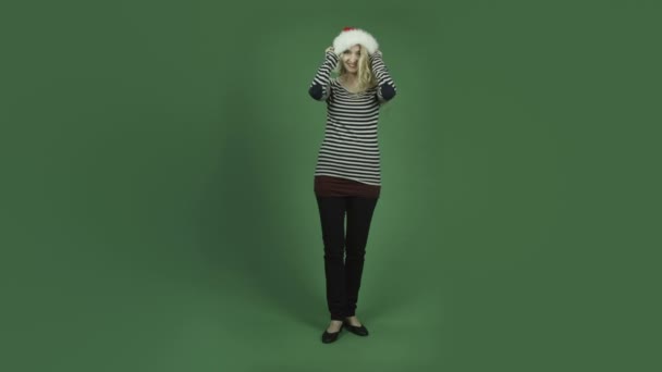 Woman dancing in santa hat — Stock Video