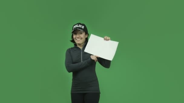 Police girl smiling with blank sign — Stock Video