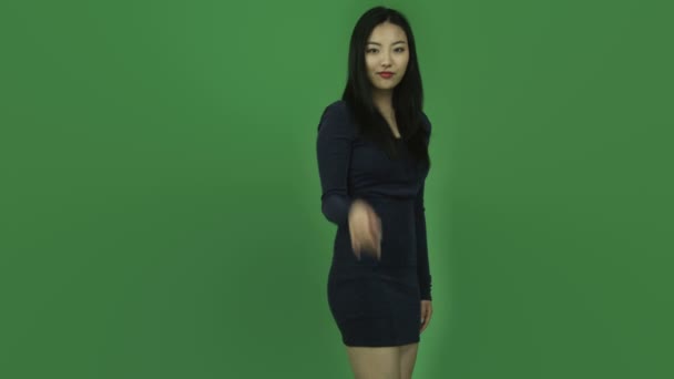Girl in dress with call me hand gesture — Stock Video
