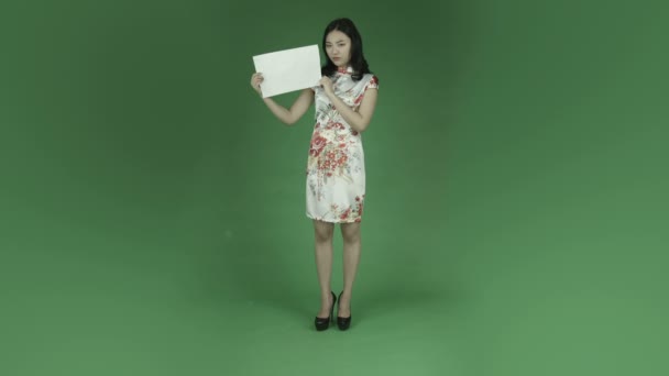 Woman in chinese dress with blank sign — Stock Video