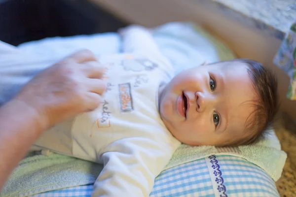 Baby boy lying on a bed — Stock Photo, Image
