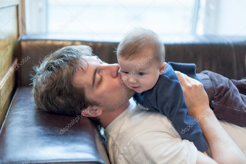 Man kissing with his baby son