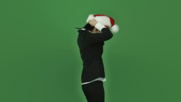 圣诞老人的帽子，做快乐的跳舞的女人 — 图库视频影像