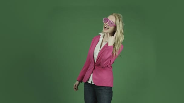 Woman in jacket with call me hand sign — Stock Video