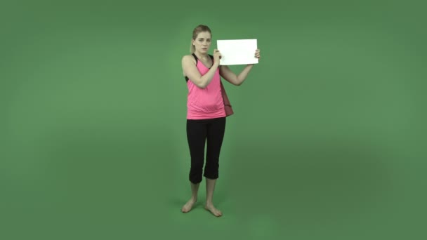 Sporty girl depressed with blank sign — Stock Video