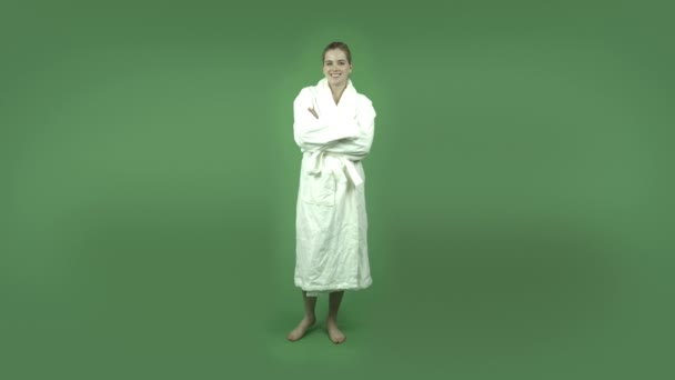 Girl in bathrobe smiling confident — Stock Video