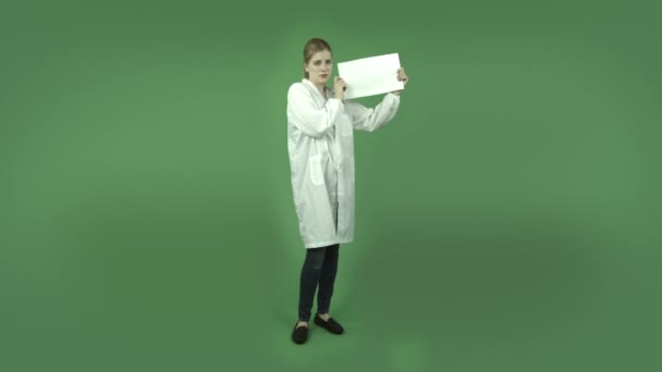 Girl in lab coat worried with blank — Stock Video