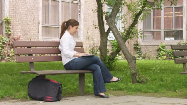 Female in relaxing the park — Stock Video