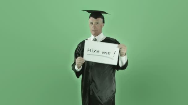 Graduate man with hire me sign — Stock Video