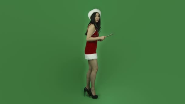 Santa girl pointing with check list — Stock Video