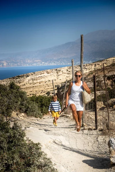 Mother Son Walking Footpath Fence Sunny Day — Stock Photo, Image