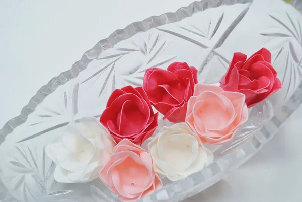 Artificial roses in glass bowl on white background — Stock Photo, Image